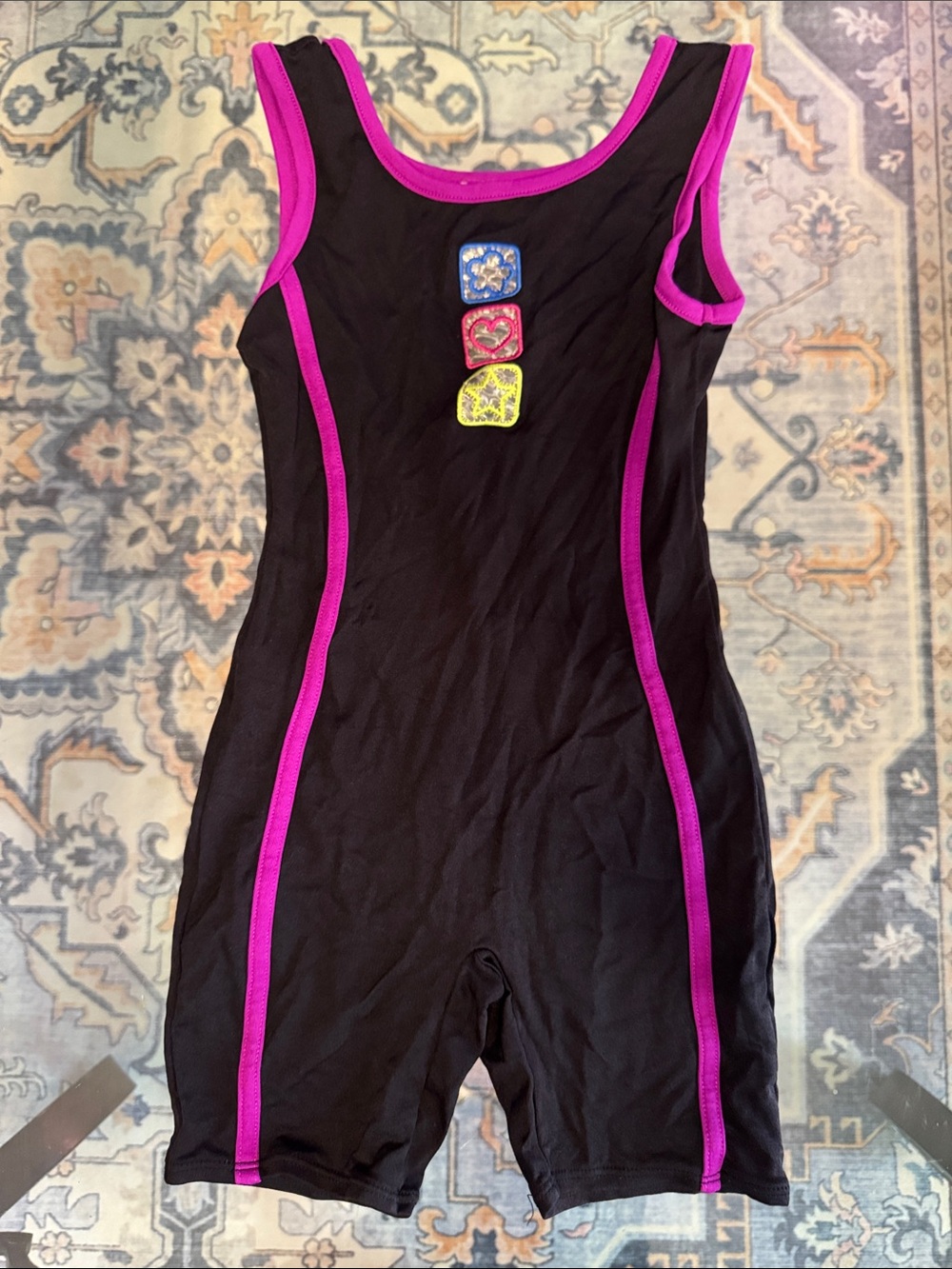 Jacques Moret Black Kids One-Piece Bodysuit with Pink Trim